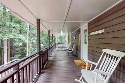 a porch of a house with rocking chairs on it at The Haggai House in Demorest