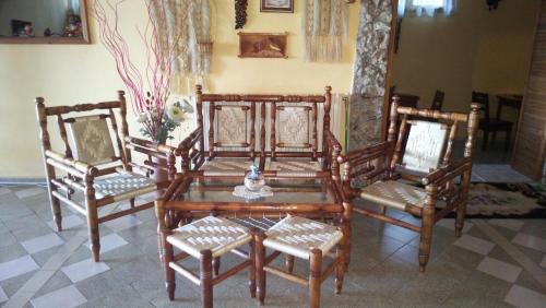 a group of chairs and a table and a table and chairs at Stefan Family Hotel in Kranevo