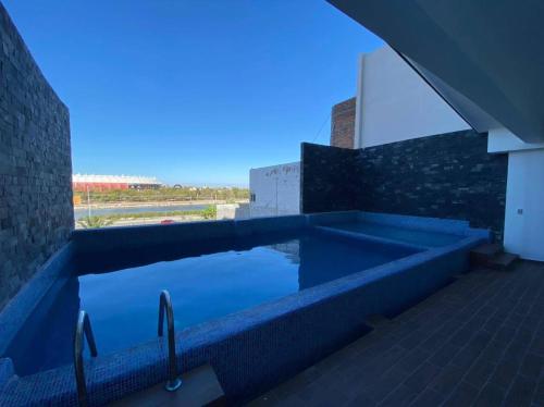 a swimming pool on the side of a building at Departamento en renta en The One Mazatlan in Mazatlán