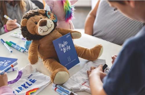 a teddy bear sitting on top of a table at Brand New Modern Holiday Home - Haven The Orchards Holiday Park in Saint Osyth
