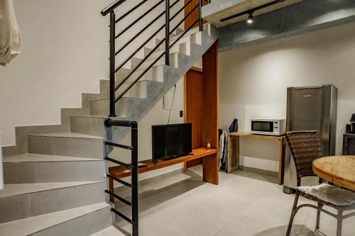 TV a/nebo společenská místnost v ubytování Flats de Sumatra