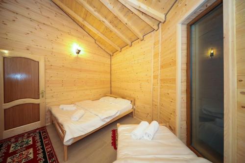 Postel nebo postele na pokoji v ubytování Malesia Eko Resort