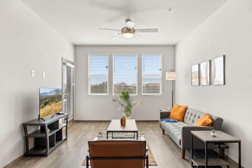 a living room with a couch and a table at Spacious Westgate CozySuites by stadium with pool 2 in Glendale