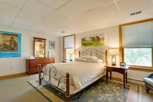 a bedroom with a bed and a desk and a window at Tannersville Vacation Rental with Pool Table! in Tannersville