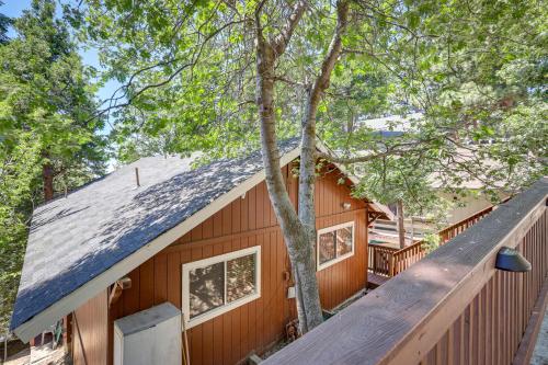 a wooden house with a gambrel roof at Rimforest Retreat with Fireplace and Mountain Views! in Rimforest