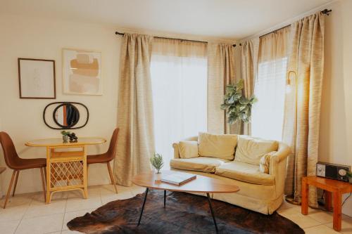 a living room with a couch and a table at Waterfront River Apartments in Rogue River
