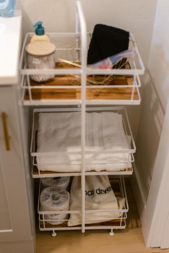 a refrigerator filled with lots of linen and towels at Waterfront River Apartments in Rogue River