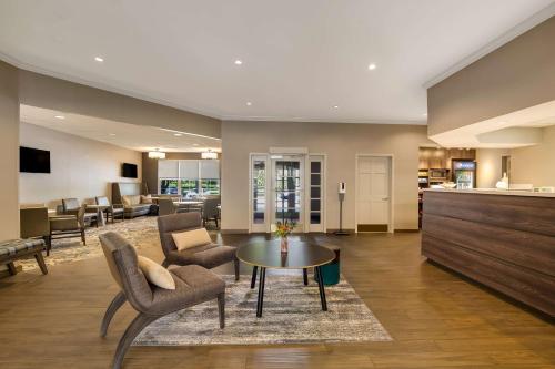 a living room with a table and chairs at Sonesta ES Suites Parsippany Morris Plains in Parsippany