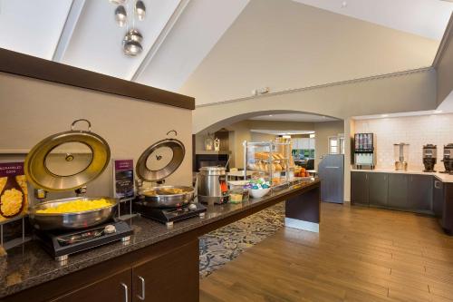 a kitchen with a buffet of food on a counter at Sonesta ES Suites Parsippany Morris Plains in Parsippany