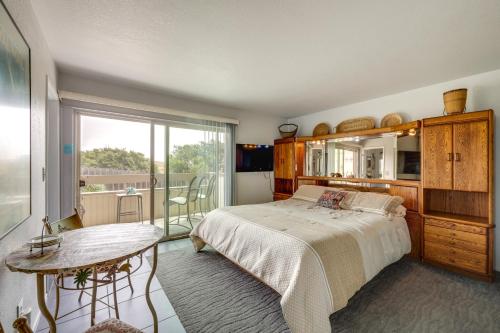 a bedroom with a bed and a table and a window at San Simeon Rental with Ocean Views Walk to Beach! in San Simeon