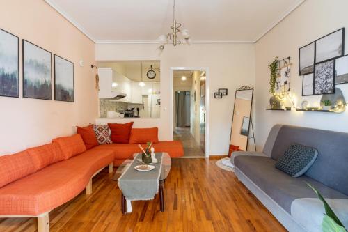 a living room with a couch and a table at Pippo's cozy home in Litochoro