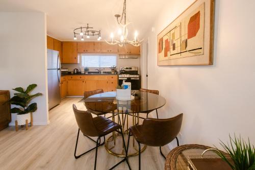 a kitchen and dining room with a table and chairs at Waterfront River Apartments in Rogue River