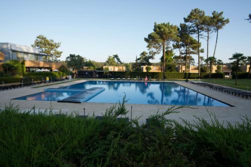 a large swimming pool in a park at Esposende Resort - Golf, Beach, River, Tennis, Pool in Gemezes