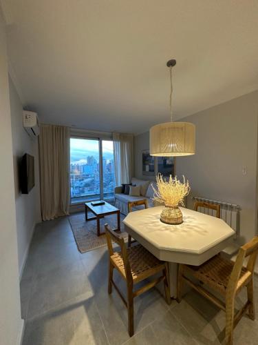 a living room with a table and a couch at Departamento en Santa Fe Capital, sobre calle Boulevard Pellegrini in Santa Fe