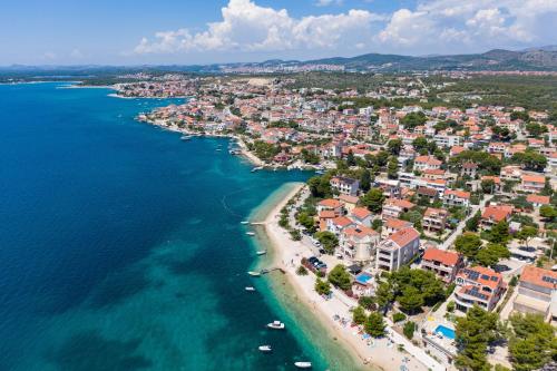 an aerial view of a beach and the ocean at Apartments with a parking space Brodarica, Sibenik - 12405 in Šibenik