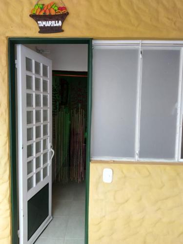 an open door leading to a room with a door at Finca La Tobita Eco Hotel in Toca