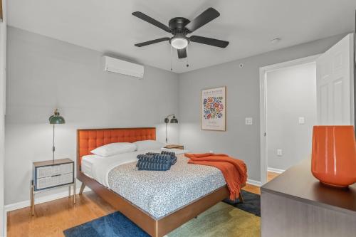 a bedroom with a bed with a ceiling fan at Stay Rafa At 259 in Philadelphia