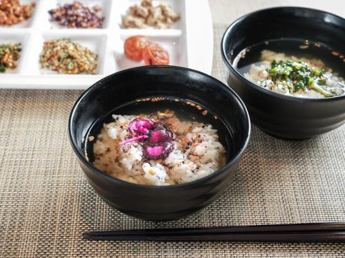 a couple of bowls of food on a table at Super Hotel Hiroshima in Hiroshima