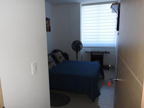 Postel nebo postele na pokoji v ubytování Santa Marta Condominio Reserva del Mar Playa Salguero frente al Mar