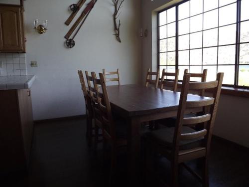 a kitchen with a wooden table and some chairs at Rr-edgewater01 in June Lake