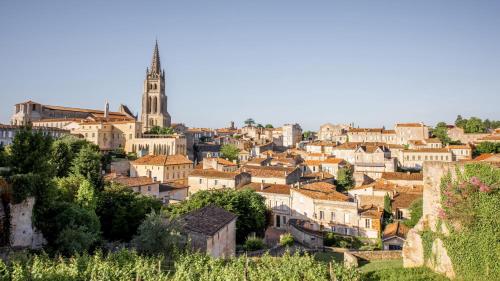 a cityscape of a town with a church tower at InterContinental Bordeaux Le Grand Hotel by IHG in Bordeaux