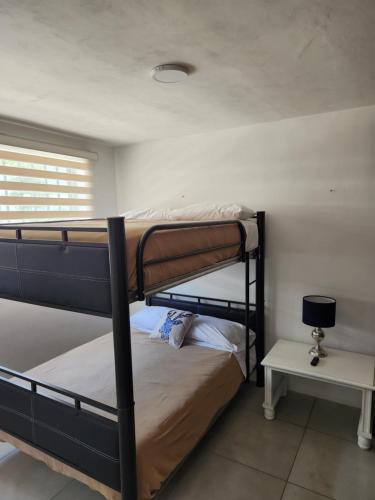 Postel nebo postele na pokoji v ubytování Depa nuevo en el corazón de GDL con seguridad y alberca