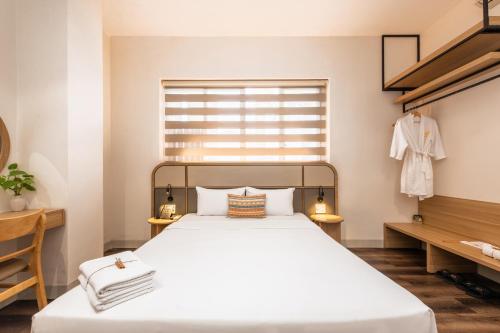 Letto o letti in una camera di Thanh Mai Hotel