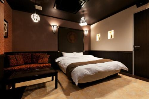 Postel nebo postele na pokoji v ubytování HOTEL GEN 福知山店