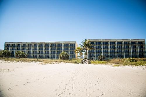 a view of a building from the beach in front of a building at Ocean Landings Resort in Cocoa Beach