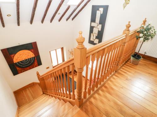 a staircase in a home with wooden floors at The Barn in Northallerton