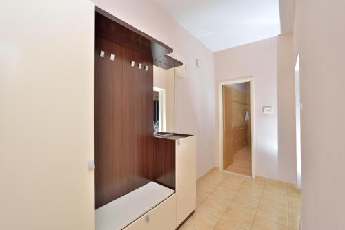 a hallway of a house with a closet at Apartment Stipić in Zadar