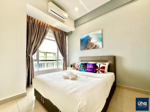 a bedroom with a large bed with a window at Midori Green By RR JBcity in Johor Bahru