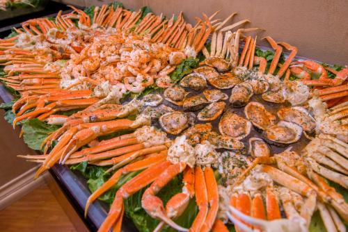 a tray of food with carrots and other vegetables at Crowne Plaza Executive Center Baton Rouge by IHG in Baton Rouge