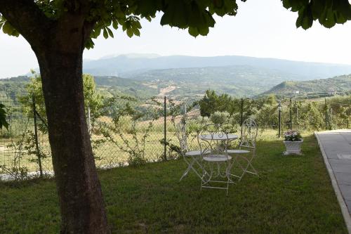 a table and chairs sitting on top of a hill at B&B La casa di Anna in Bucchianico