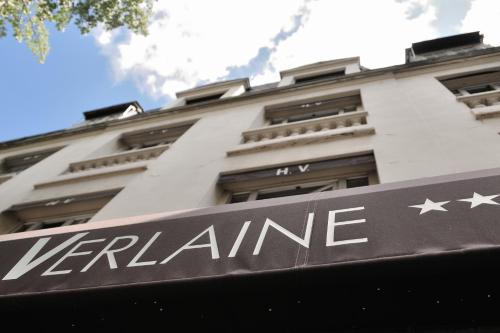 a building with a sign that reads verlane at Hôtel Verlaine in Paris