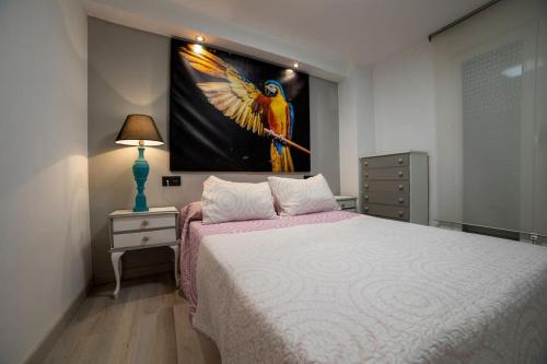 Tempat tidur dalam kamar di Apartamento Ventanal