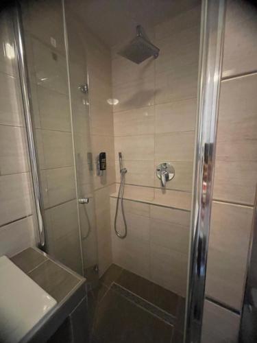 a bathroom with a shower and a sink at Hotel Sonne in Weingarten