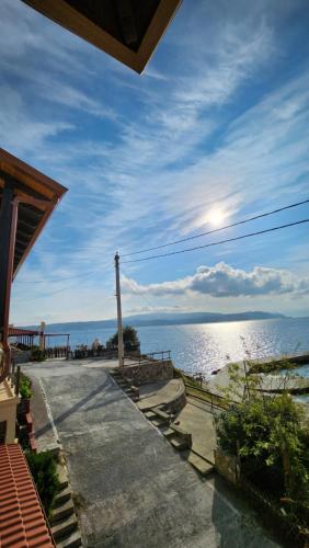 a view of the ocean from a house at Gianni's Apartment By The Sea in Ammouliani