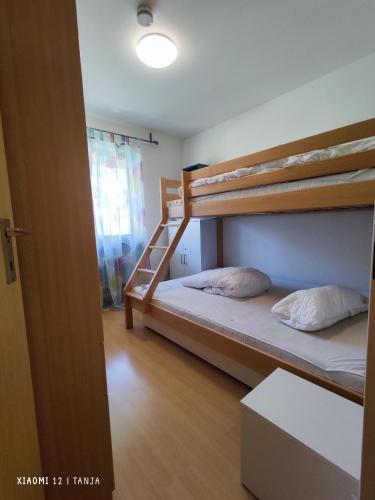 a bedroom with two bunk beds and a door at Konstanzer Sonne 