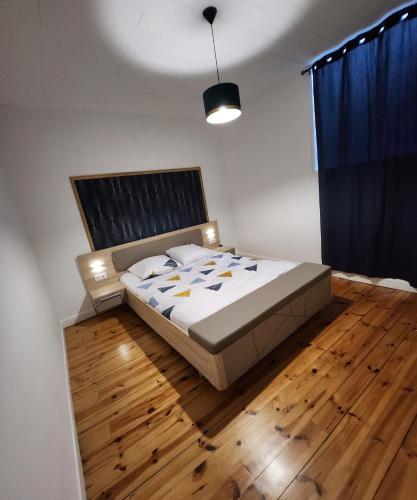 Кровать или кровати в номере Chaleureux appartement refait à neuf