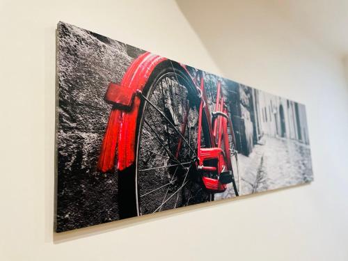 a painting of a bike on a wall at La casa del Borgo Anagni in Anagni