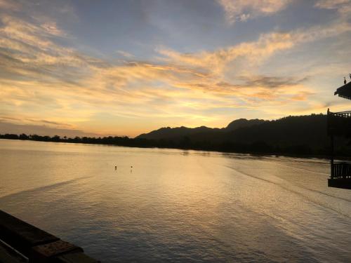 a view of a river with the sun setting at Langkawi Lagoon Water Villa VIP in Pantai Cenang