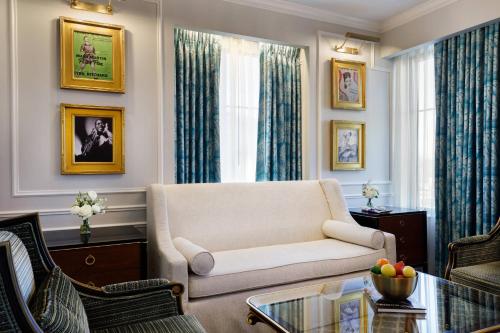 a living room with a couch and a table at Hotel Carmichael, Autograph Collection in Carmel