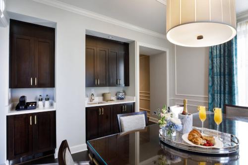 a kitchen with a table with a plate of food on it at Hotel Carmichael, Autograph Collection in Carmel