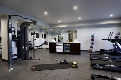 a room with a gym with treadmills and machines at Hotel Carmichael, Autograph Collection in Carmel