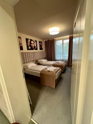 Кровать или кровати в номере Floral Boutique Hotel