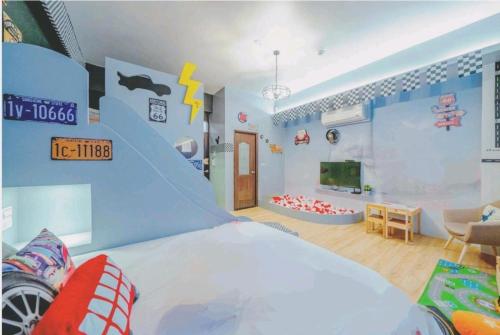 a childs room with a bedroom with a shark wall at 宜蘭1955親子民宿一館 in Wujie