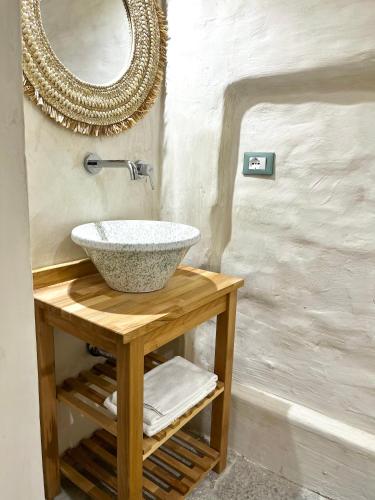 a bathroom with a sink and a mirror at Ruggine Loft in Gallipoli