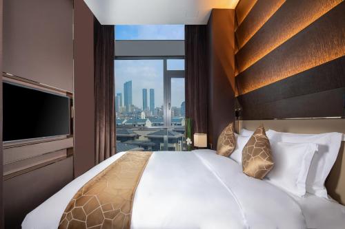 Katil atau katil-katil dalam bilik di Rocase Boutique Hotel Wuxi
