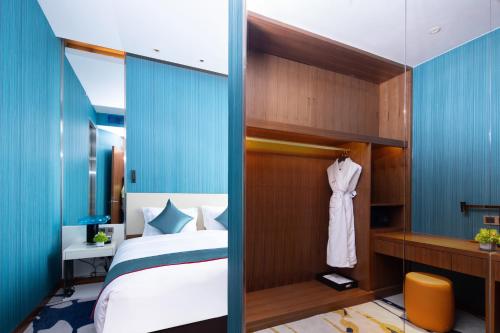 Katil atau katil-katil dalam bilik di Rocase Boutique Hotel Wuxi